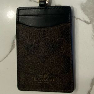 Coach Lanyard gently used has 2 card slots in addition to the clear badge holder
